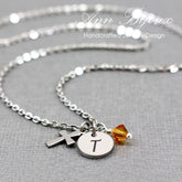 This Personalized Cross and Initial Birthstone Necklace is a meaningful blend of faith and personal identity.