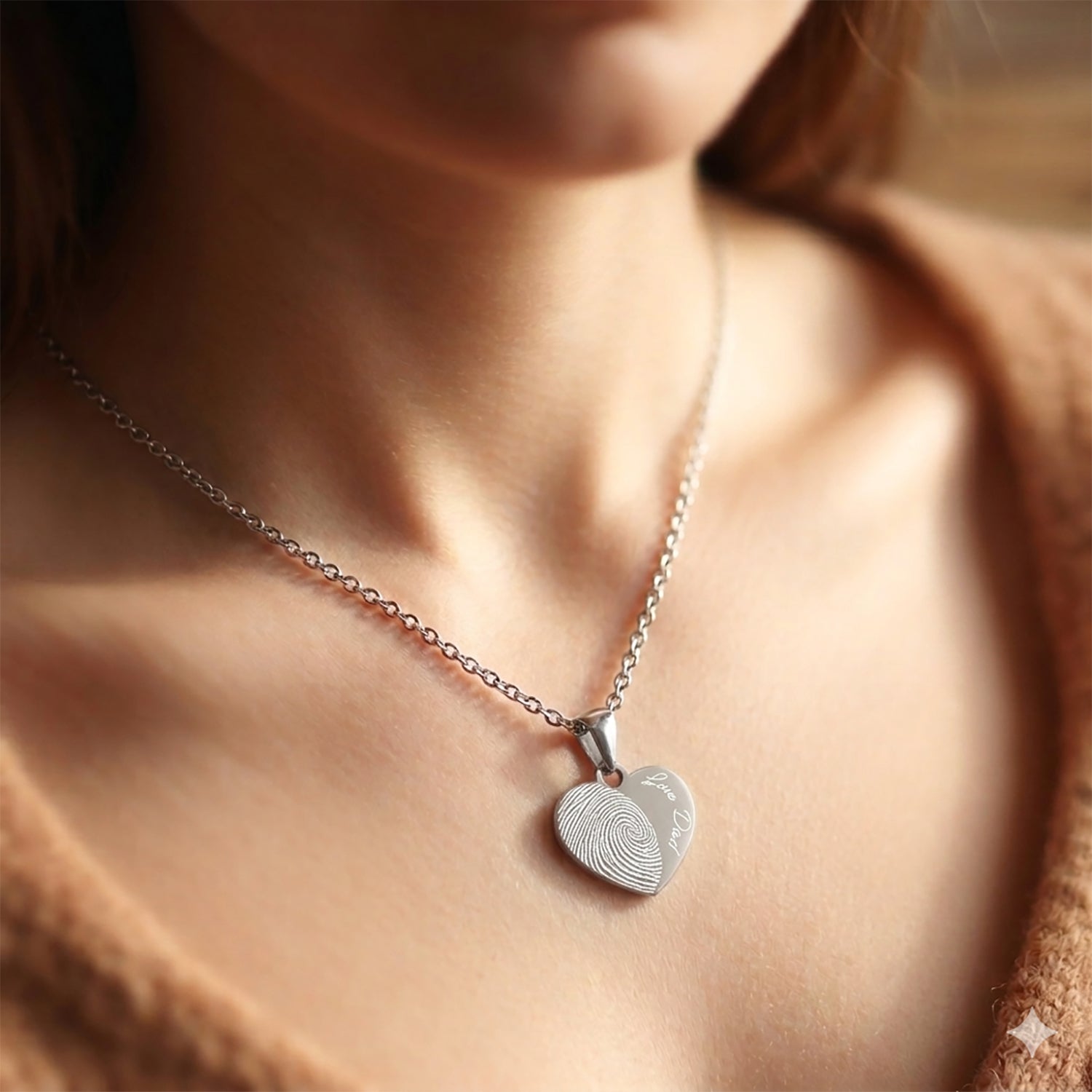 "Personalized memorial heart necklaces featuring actual fingerprints and custom handwritten messages. Available in gold, silver, and rose gold finishes, these pendants serve as a unique keepsakes for loss or family gifts."