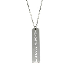 A stainless steel necklace with a cross pendant featuring a engraved text on it, attached to a chain.