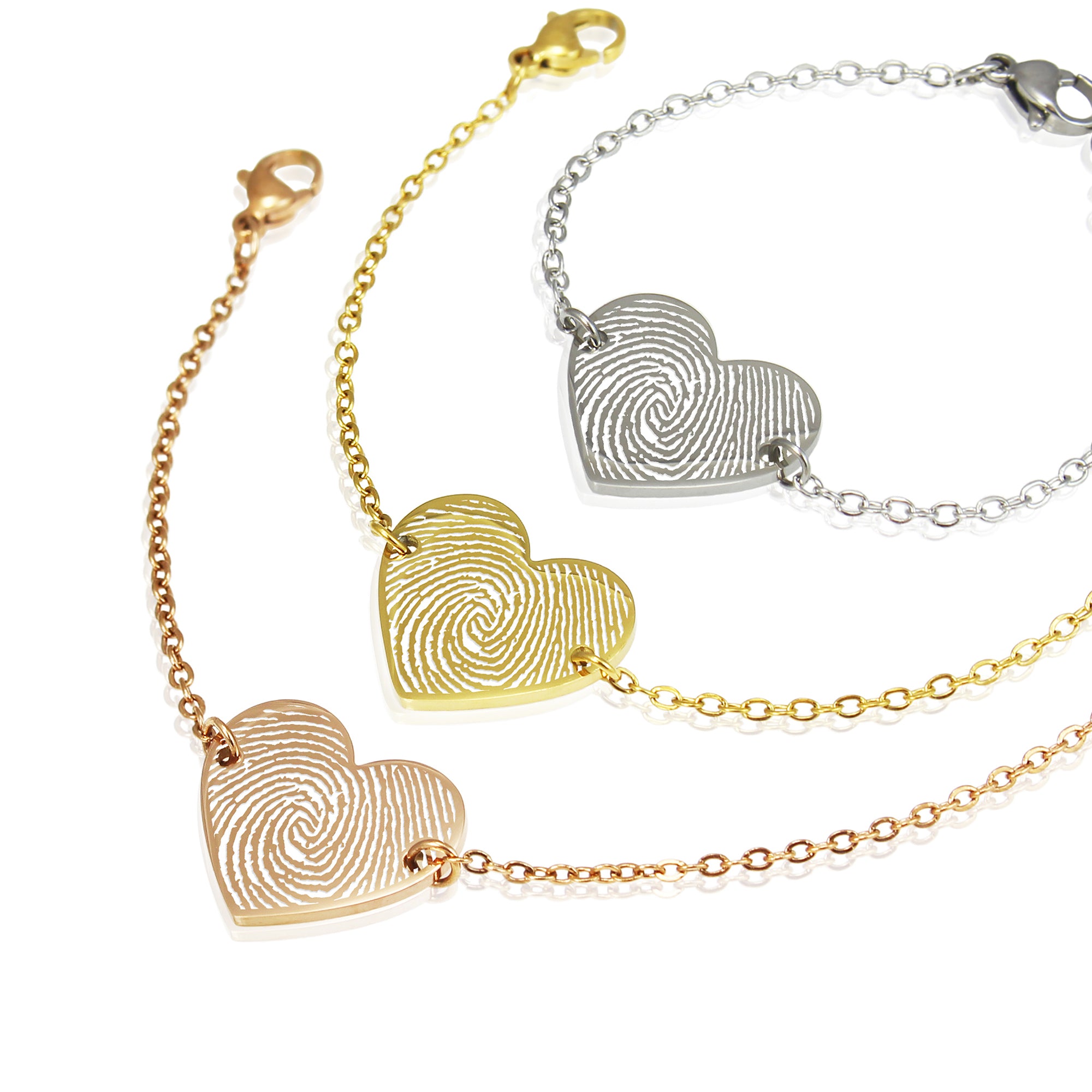 Bracelet with fingerprint hearts in gold and silver on a white background