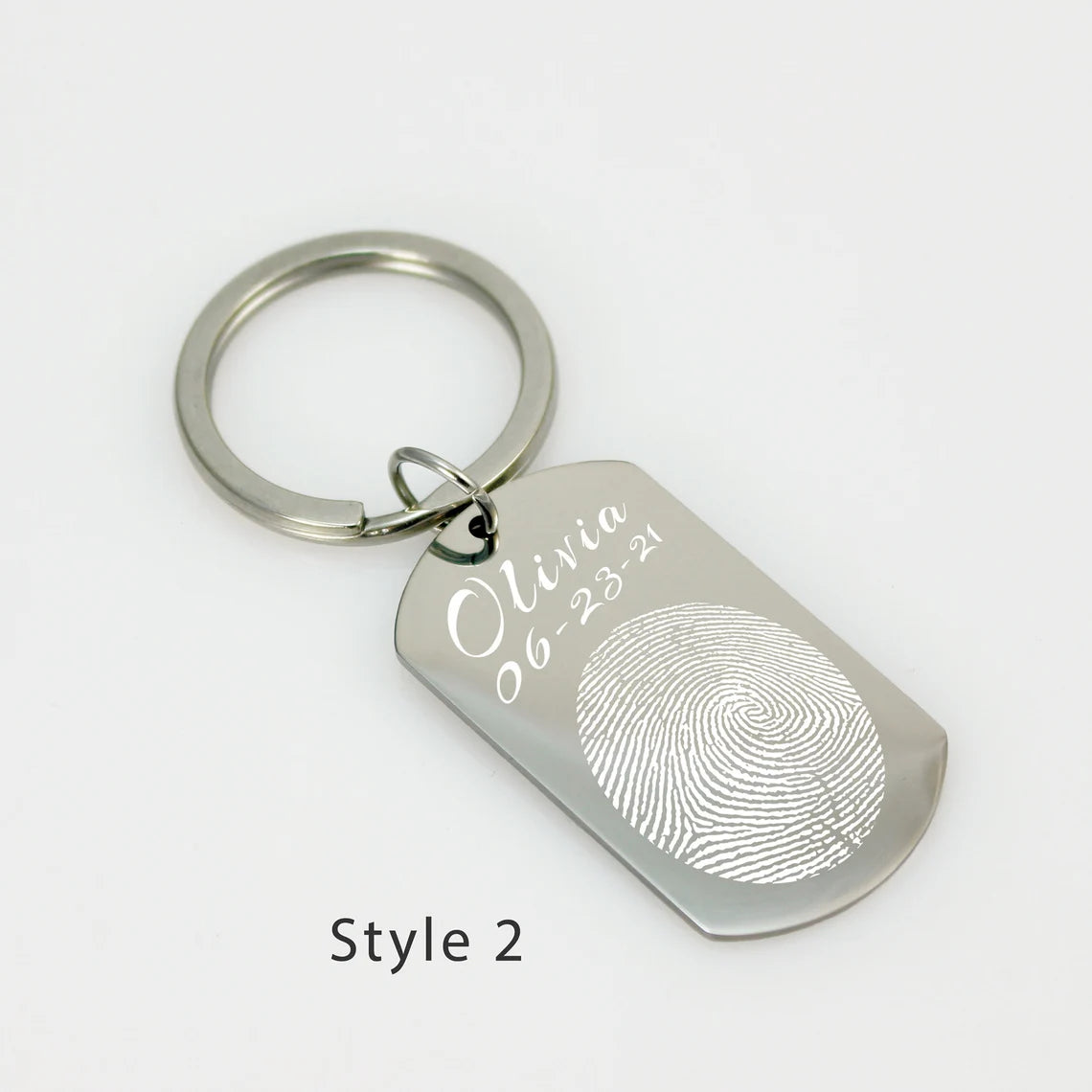Rectangular stainless steel personalized fingerprint keychain with a rounded bottom and split ring attachment.
