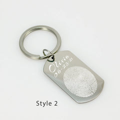 Rectangular stainless steel personalized fingerprint keychain with a rounded bottom and split ring attachment.
