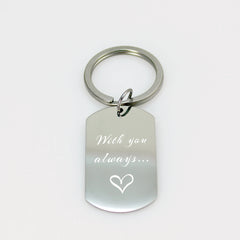 Personalized fingerprint engraved dog tag keychain in polished silver.