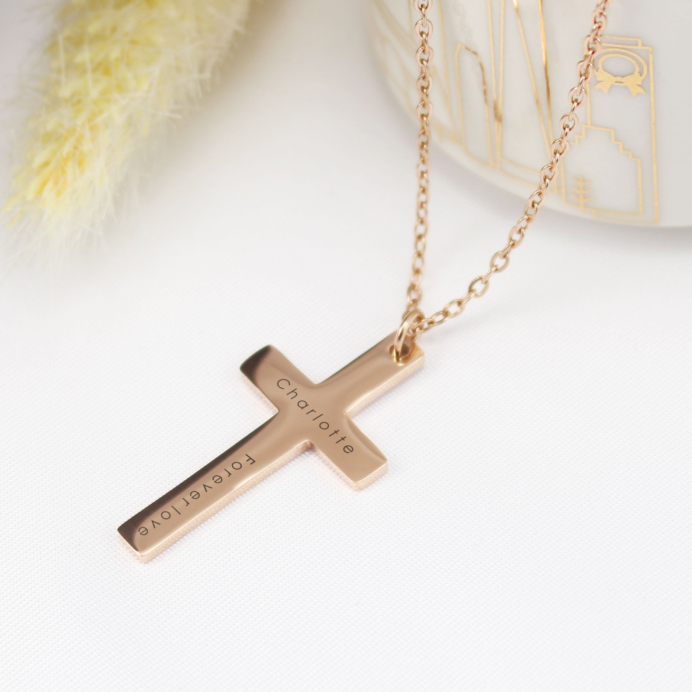"A side-by-side comparison showing a handwritten note 'Love you always' on white paper being transformed into a custom engraved silver heart pendant necklace in the same exact handwriting style."
