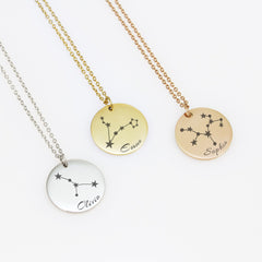 Each piece features a delicate, minimalist engraving of a zodiac constellation paired with a custom name in an elegant script font. 