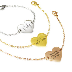 Three heart-shaped bracelets with engraved text on a white background