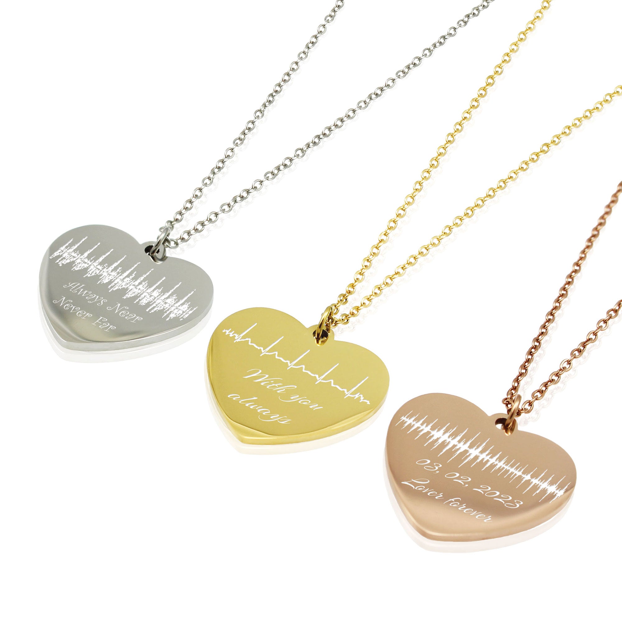 Three heart-shaped necklaces with engraved text and heartbeat on a white background
