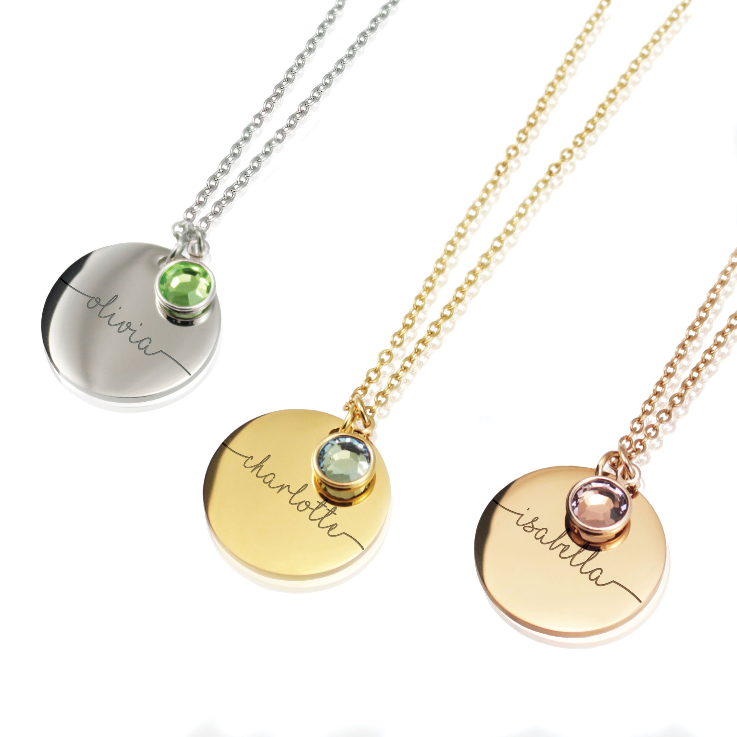 "Three personalized disc necklaces in silver, gold, and rose gold finishes, each featuring a custom script name engraving—Olivia, Charlotte, and Isabella—paired with colorful round birthstone charms."