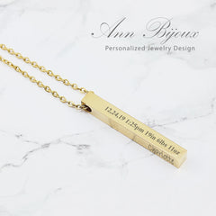 Custom engraved vertical bar necklace in gold and rose gold, personalized coordinate jewelry and Roman numeral anniversary gift.