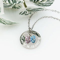 Custom engraved latitude and longitude necklace in silver with two bicone crystal pendants in lavender and aquamarine blue.