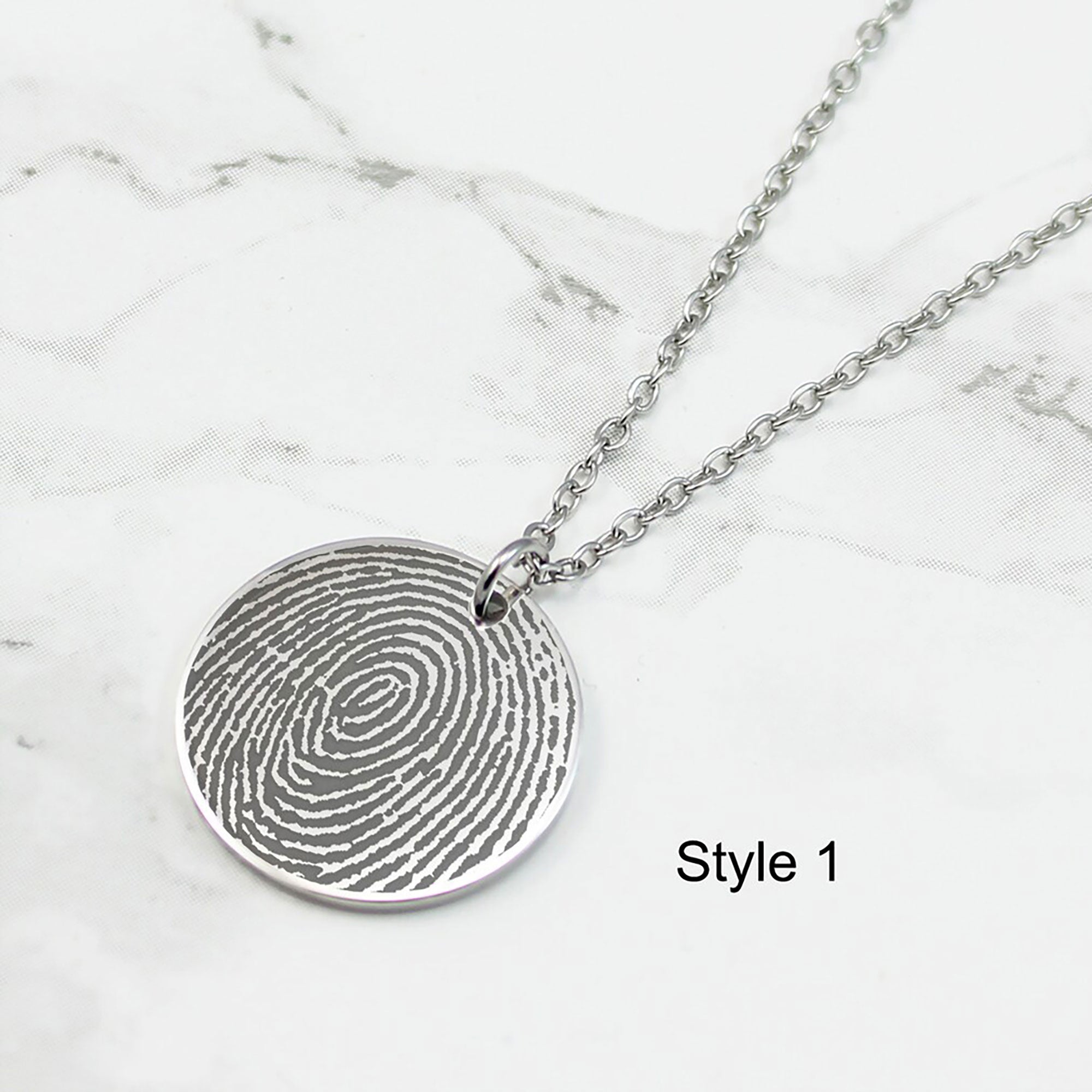 Personalized fingerprint engraved disc necklaces in silver, gold, and rose gold with custom name engravings for Mom and Grandma.