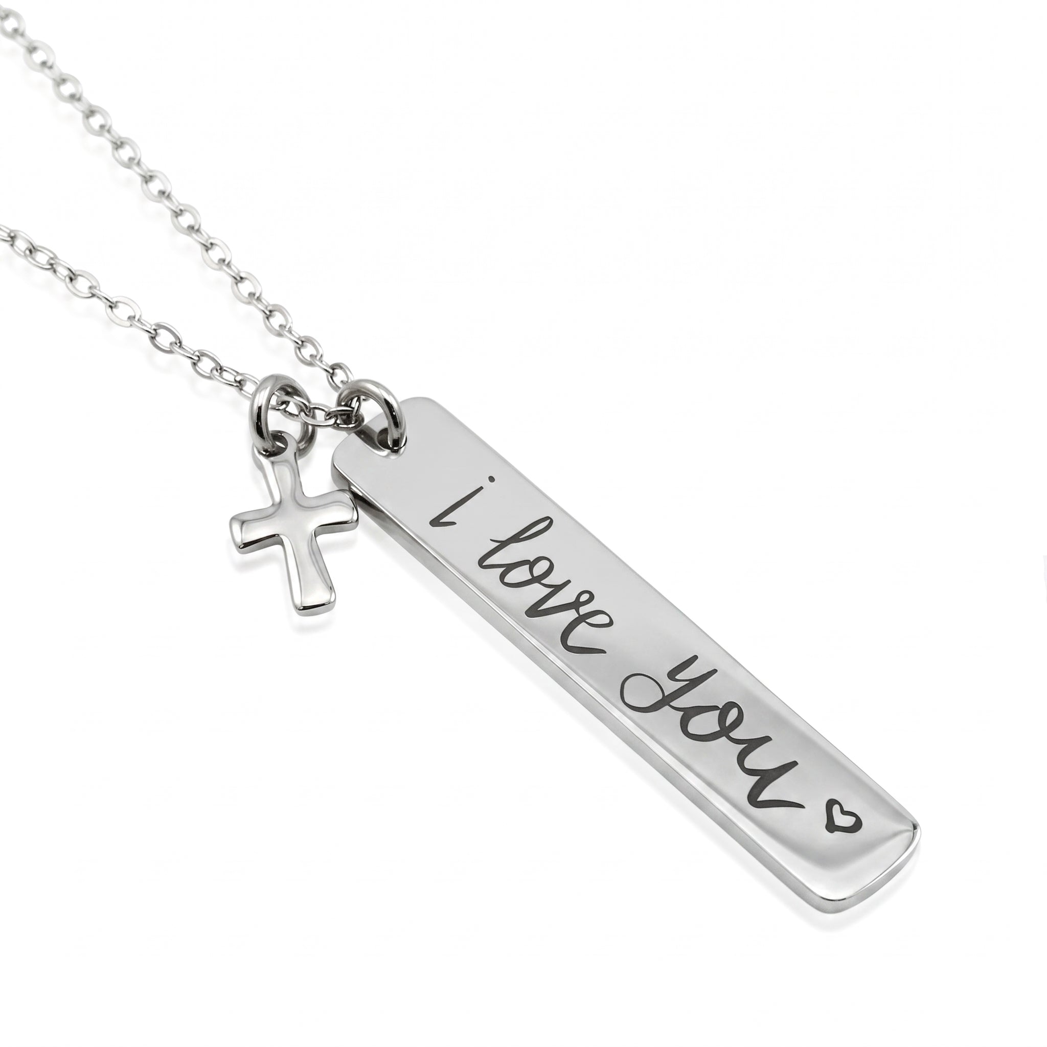 A silver necklace featuring a rectangular bar pendant engraved with 'i love you' and a small hanging cross charm, shown on a plain white background.