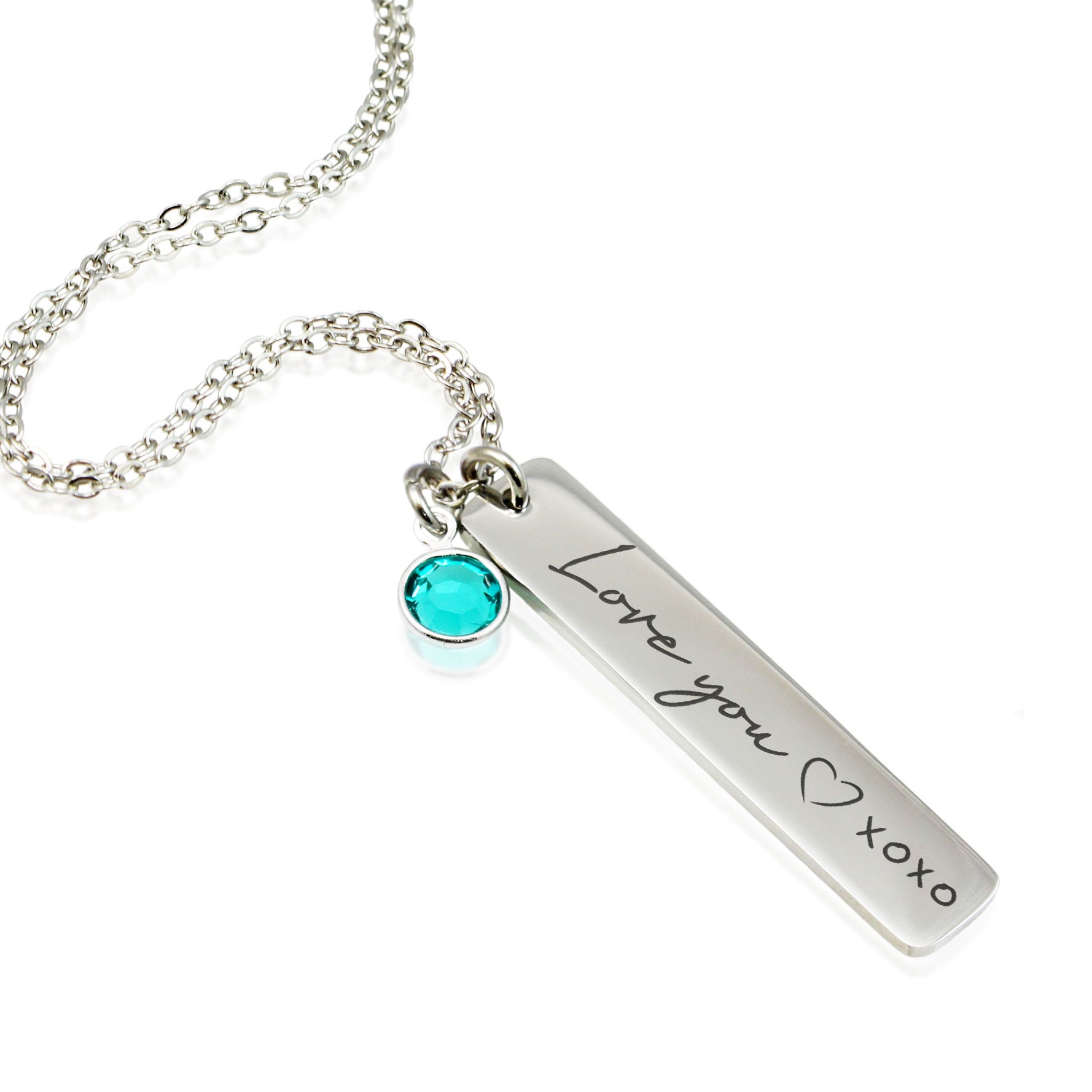 "Custom silver vertical bar necklaces for families. Each bar is engraved with a personalized name—like Mom, Anna, and Isabella—in a elegant script font. A single corresponding round birthstone charm (blue, red, and purple) hangs from the delicate chain above each pendant."