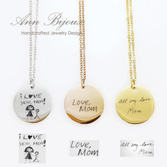 Custom handwriting and child’s drawing engraved necklaces in silver, gold, and rose gold.