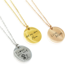 Three organic-shaped disc necklaces in silver, gold, and rose gold. The silver pendant is engraved with a child's drawing and "I love you, Mom," while the gold and rose gold pendants feature custom handwriting engravings that say "all my love, Mom" and "Love, Mom."