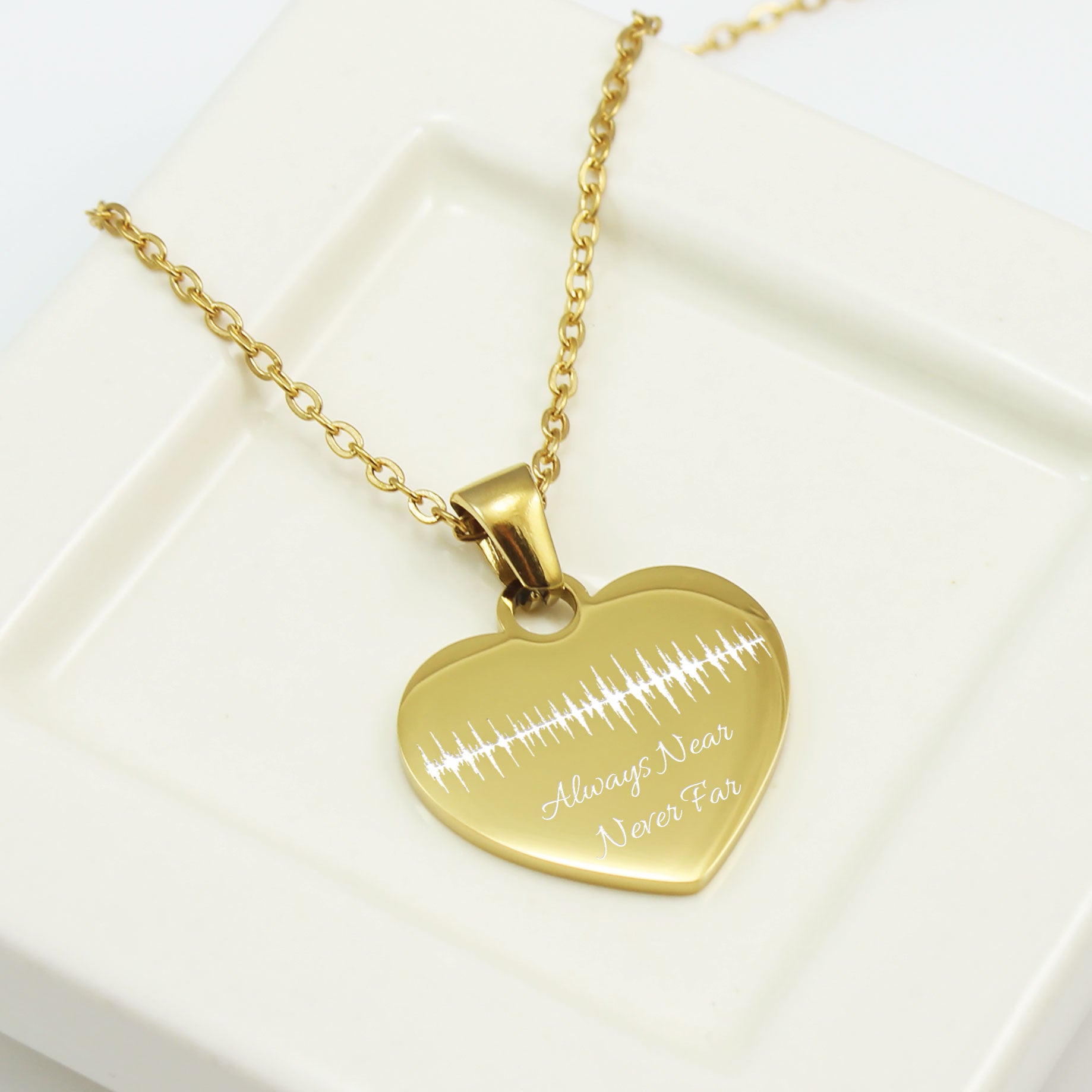 "Custom soundwave heart necklace in silver with personalized name and date engraving."