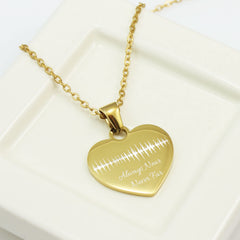 "Custom soundwave heart necklace in silver with personalized name and date engraving."
