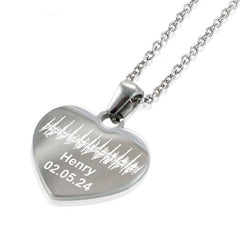 "Silver heart pendant necklace featuring a custom engraved soundwave pattern. The personalized jewelry includes the name 'Henry' and a date '02.05.24' etched below the unique audio wave design."