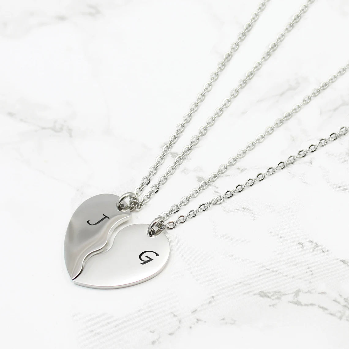 Custom initial split heart necklace set in polished silver, personalized friendship jewelry and couples anniversary gift.
