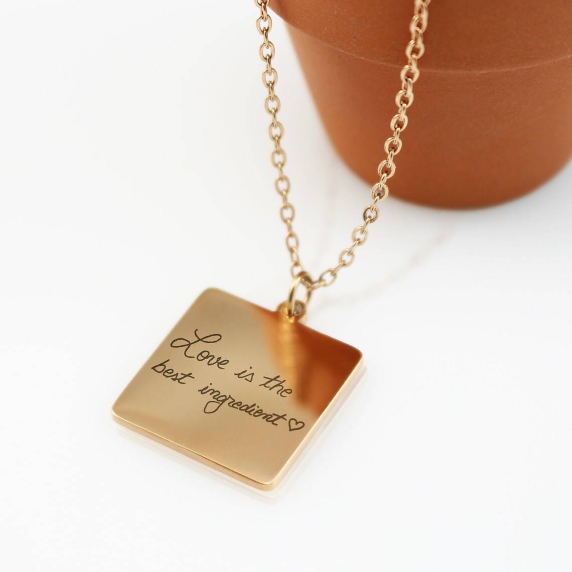 Handwritten note engraved necklaces in three metal finishes: silver, yellow gold, and rose gold.