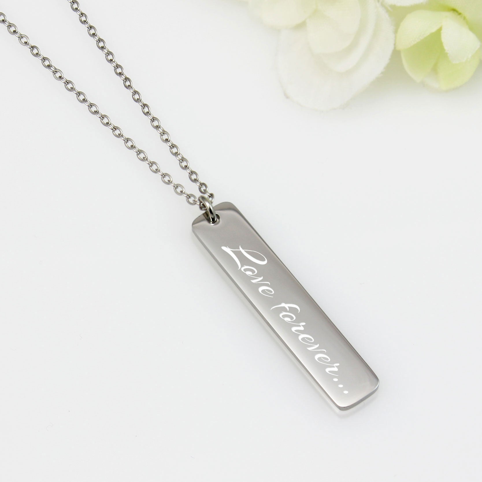 Vertical silver bar necklace featuring a custom engraved sound wave pendant on a delicate link chain. A unique personalized jewelry gift for capturing voice recordings or favorite songs.