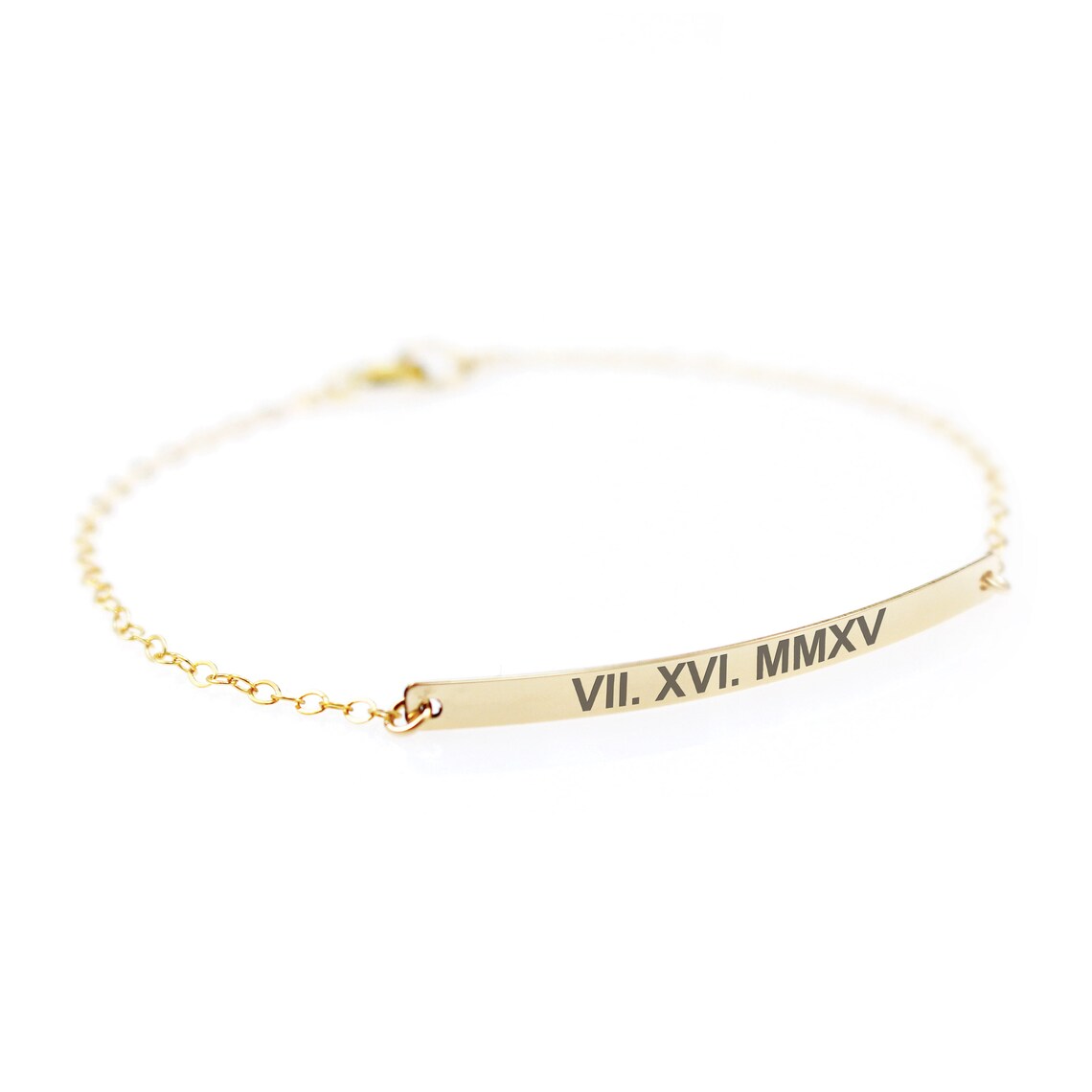 A slender, polished silver horizontal bar engraved with roman number, attached to a thin silver chain against a clean white background.