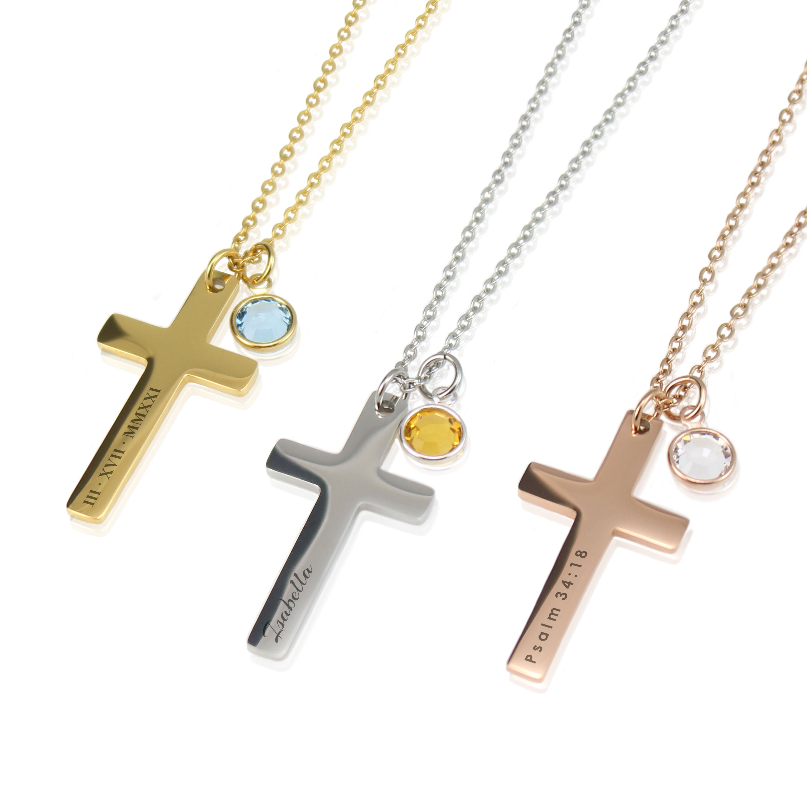 Custom engraved cross necklaces with birthstone charms in gold, silver, and rose gold.