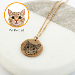 "Custom engraved pet portrait necklaces in various metals with cat, dog, and paw print designs."